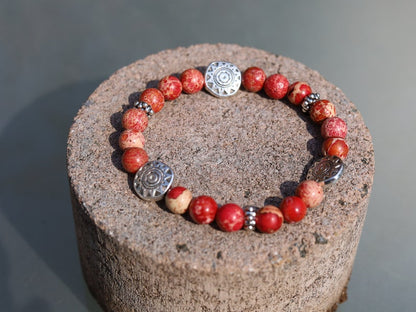 Shine Natural Sea Sediment Red Jasper with Sun Patterns.  Represents the highest form of intelligence, spiritual intelligence.