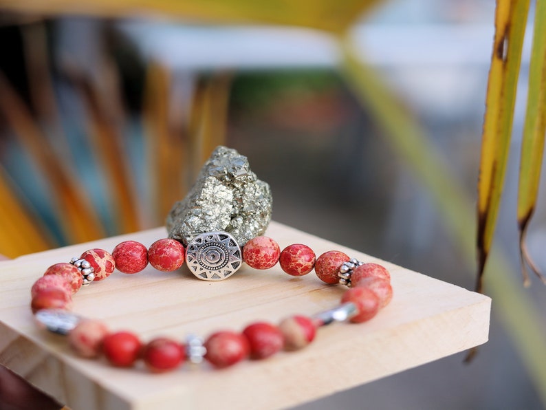Shine Natural Sea Sediment Red Jasper with Sun Patterns.  Represents the highest form of intelligence, spiritual intelligence.