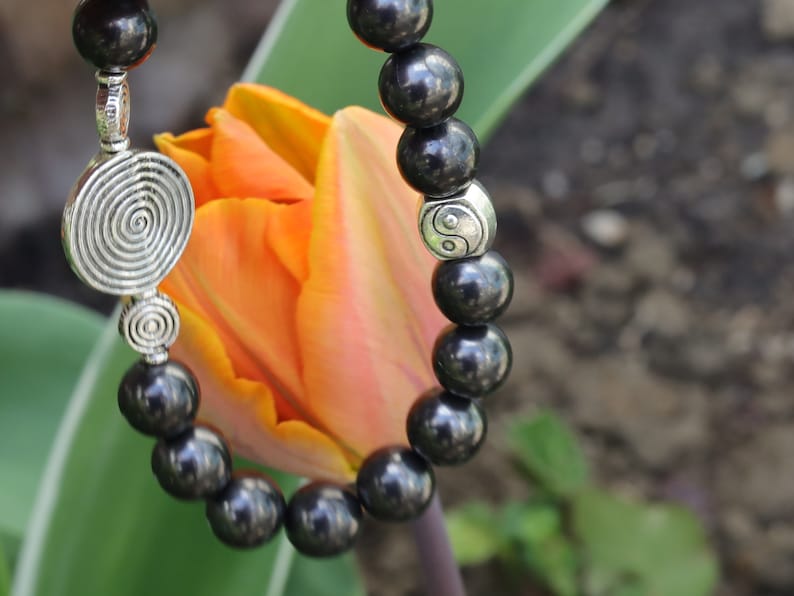 bLACKLINE SERIES Shungite bracelets combined with The Universe Spiral. Reach harmony between your body and soul.