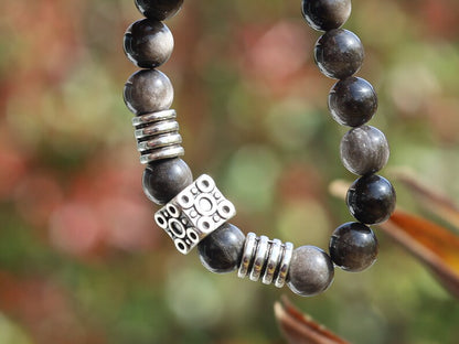 Magnificent semi Precious Stone Smooth Silver Sheen Obsidian Gemstone Beads bracelet. Combined with beautiful cube Bead.