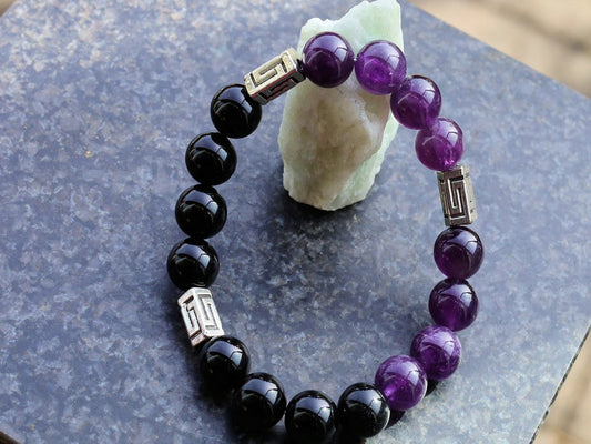 Unfrequent Amethyst crystal bracelet with Black Agate.  Connect to your inner peace and leave the rest behind.