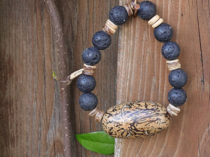 Special big  Lava stones bracelet with beautiful and very large bead: Tropical Seed/Kernel. Buddha Tree Seeds Bead.