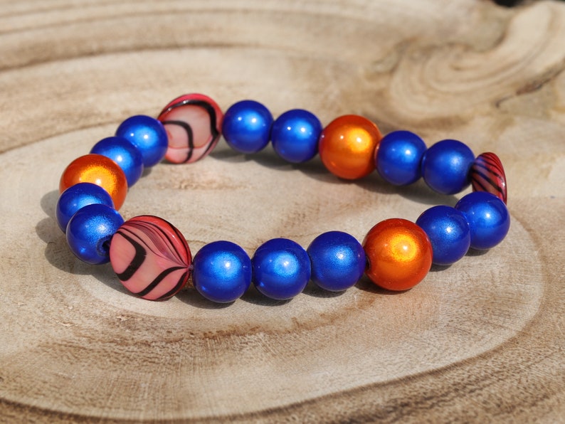 Summer of Love Jewel Collection - 10 mm 3D Miracle beaded bracelet with  Mother of Pearl Shell beads. Exclusive Design Principles.