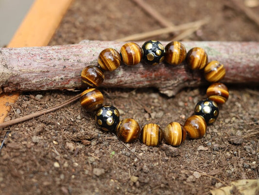 Summer of Love Jewel Collection - 12 mm beaded yellow Tiger eye bracelet with 3x big Handmade Indonesia Bead. Truly inspiring.