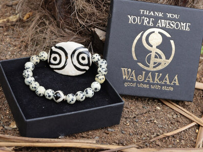 2 eyes Tibetian Dzi bead with Natural Dalmatian Jasper. The secret lies in the dZi patterns. Tibetan bracelet made by local craftsmen