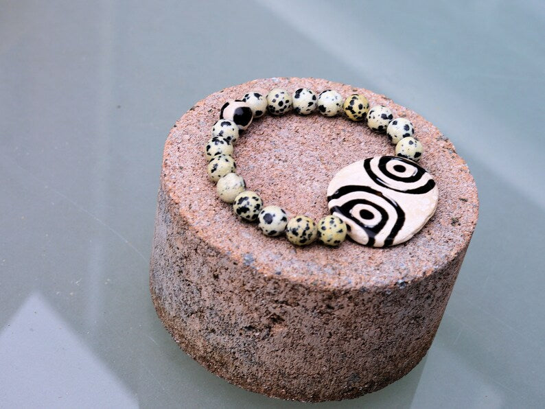 2 eyes Tibetian Dzi bead with Natural Dalmatian Jasper. The secret lies in the dZi patterns. Tibetan bracelet made by local craftsmen