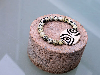 2 eyes Tibetian Dzi bead with Natural Dalmatian Jasper. The secret lies in the dZi patterns. Tibetan bracelet made by local craftsmen