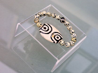 2 eyes Tibetian Dzi bead with Natural Dalmatian Jasper. The secret lies in the dZi patterns. Tibetan bracelet made by local craftsmen