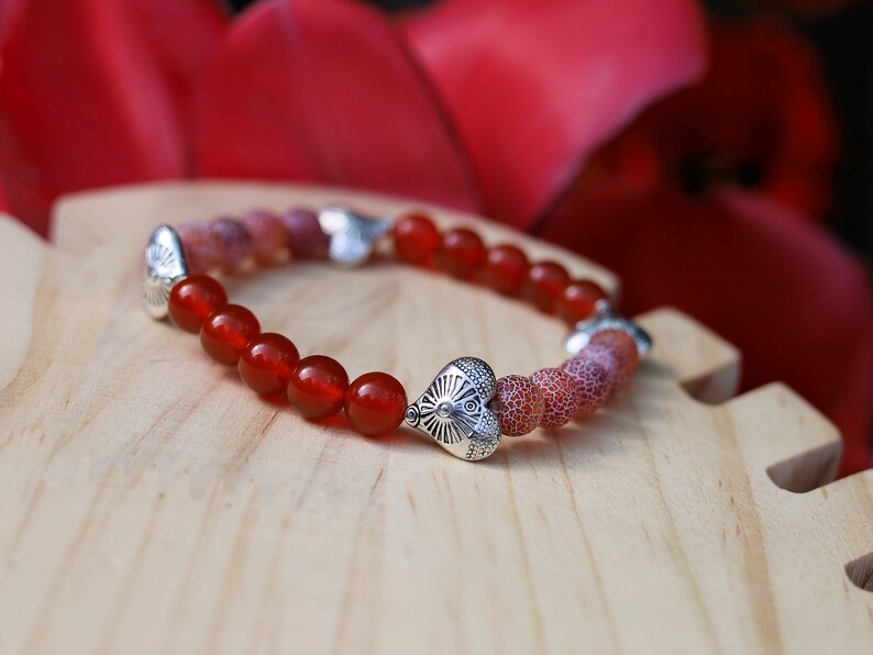 Subliminal Carnelian combined with Matte Frosted Agate Beads and beautiful Tibetan Style Carved Heart. Efficient, positive communication.