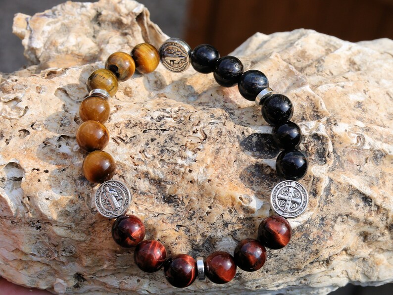Devoted TRI color Tiger eye bracelet with Jesus and Latin Cross. Pagan symbol in Asian and African countries and a platform for crucifixion