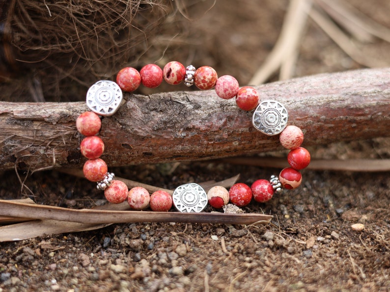 Shine Natural Sea Sediment Red Jasper with Sun Patterns.  Represents the highest form of intelligence, spiritual intelligence.