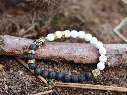Astral black and white lava bracelet with Antique Style Buddha head and Wajakaa © Logo bead. provides strength and clear thinking