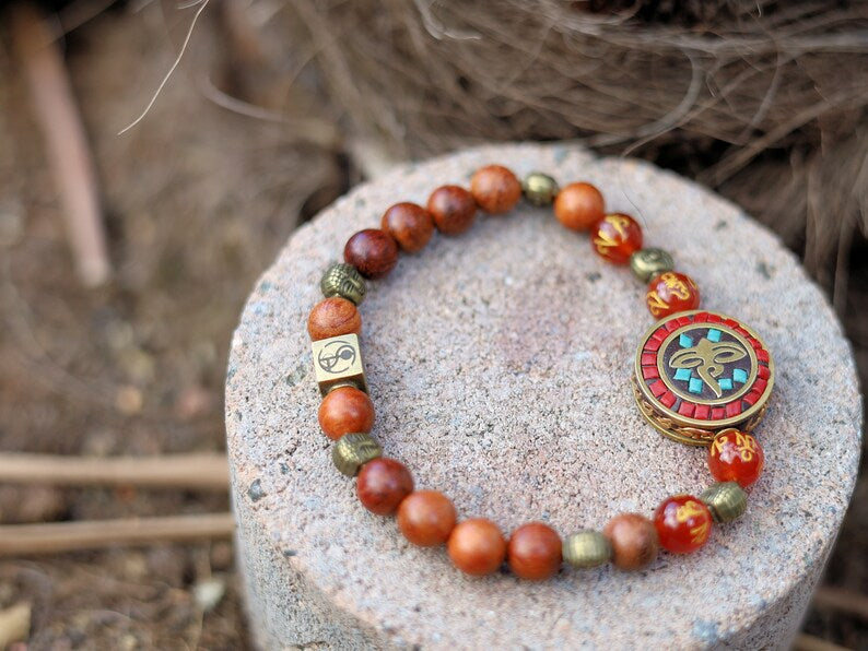 Heavenly Natural Wood Beads with Buddha eyes Bead Combined with Wajakaa © Logo bead and 6 Buddha head, Antique Bronze.