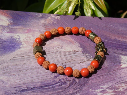 Godlike Red Coral / Rudraksha bracelet with Antique Style Buddha head and Wajakaa © Logo bead.  ‘one who is awake’