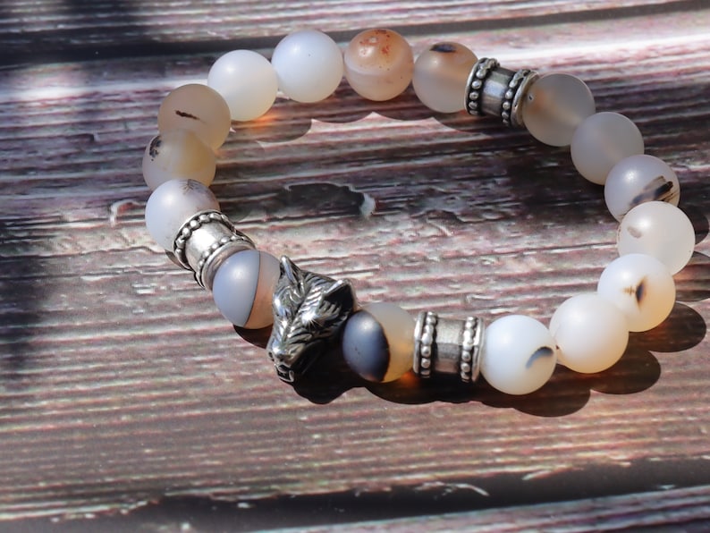 Vet Matte Moss Agate Beads bracelets combined with a Wolf Head. Unique, handmade symbolic jewelry that reflects your style & beliefs.
