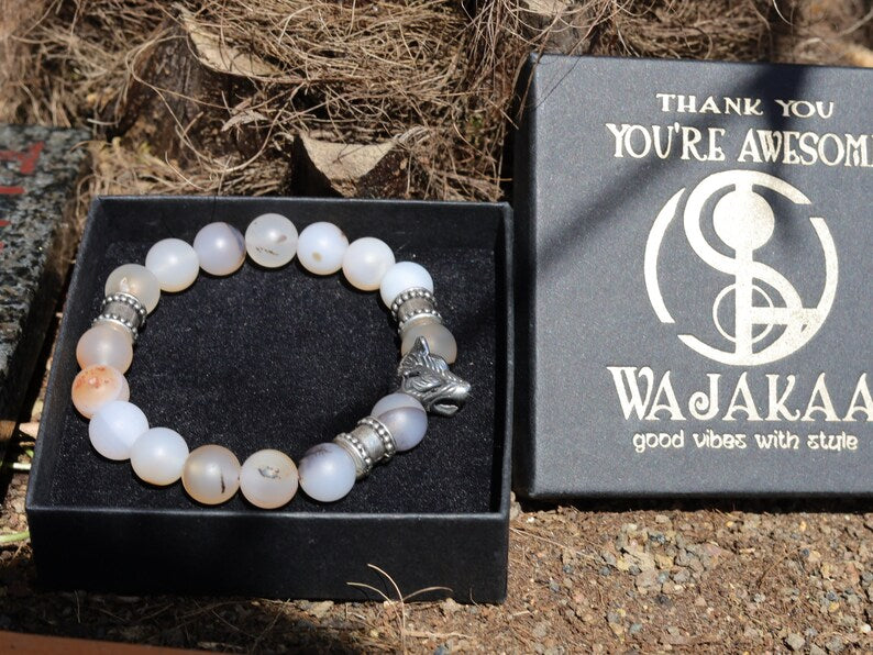 Vet Matte Moss Agate Beads bracelets combined with a Wolf Head. Unique, handmade symbolic jewelry that reflects your style & beliefs.