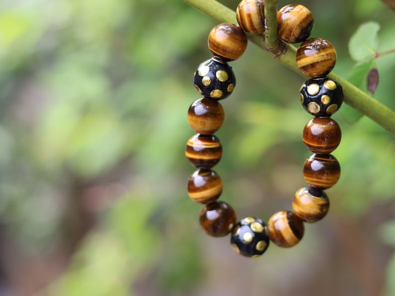 Summer of Love Jewel Collection - 12 mm beaded yellow Tiger eye bracelet with 3x big Handmade Indonesia Bead. Truly inspiring.