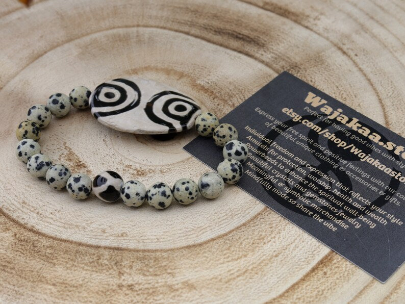 2 eyes Tibetian Dzi bead with Natural Dalmatian Jasper. The secret lies in the dZi patterns. Tibetan bracelet made by local craftsmen