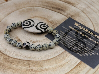 2 eyes Tibetian Dzi bead with Natural Dalmatian Jasper. The secret lies in the dZi patterns. Tibetan bracelet made by local craftsmen