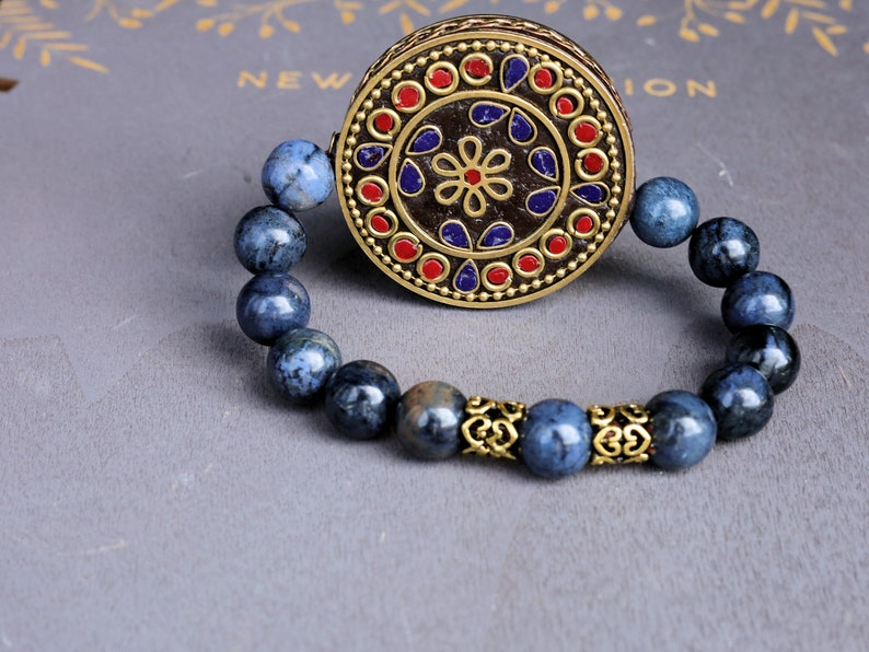 Outstanding Dumortierite bracelet combined with a Handmade big Indonesia Bead. Stimulating brain and brings enhanced intellectual abilities