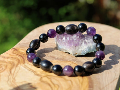 Far-out Tourmaline and Amethyst crystal bracelet with A very nice set of 4 handmade Horn Beads.  presence of compassion and wisdom