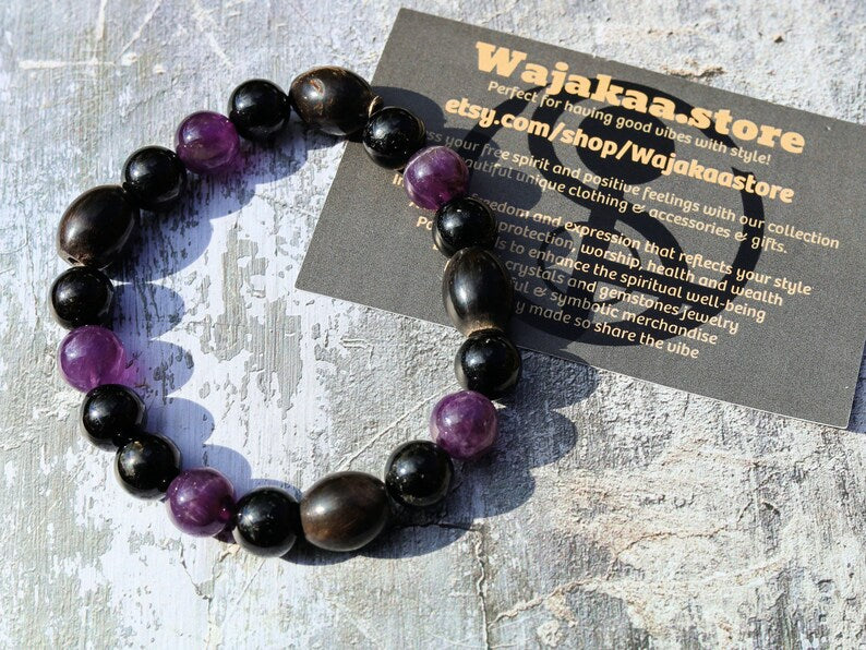 Far-out Tourmaline and Amethyst crystal bracelet with A very nice set of 4 handmade Horn Beads.  presence of compassion and wisdom