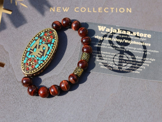 Swank Red Tiger Eye bracelet combined with a Handmade big truly inspiring Indonesia Bead. "The jewel is in the lotus".