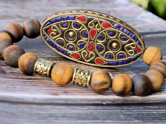 Nifty matte Tiger eye bracelet combined with a Handmade big truly inspiring Indonesia Bead.