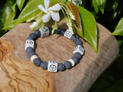 Peaceful grey Lava stones bracelet combined with Ceramic Cube Peace Sign Design.Symbol designed for the British nuclear disarmament movement