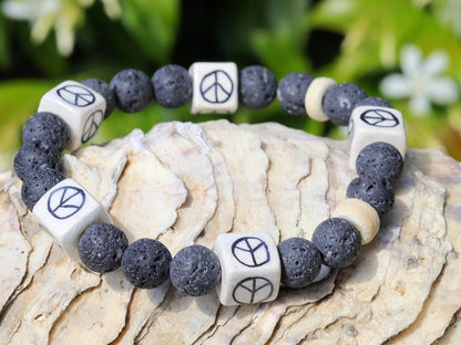 Peaceful grey Lava stones bracelet combined with Ceramic Cube Peace Sign Design.Symbol designed for the British nuclear disarmament movement