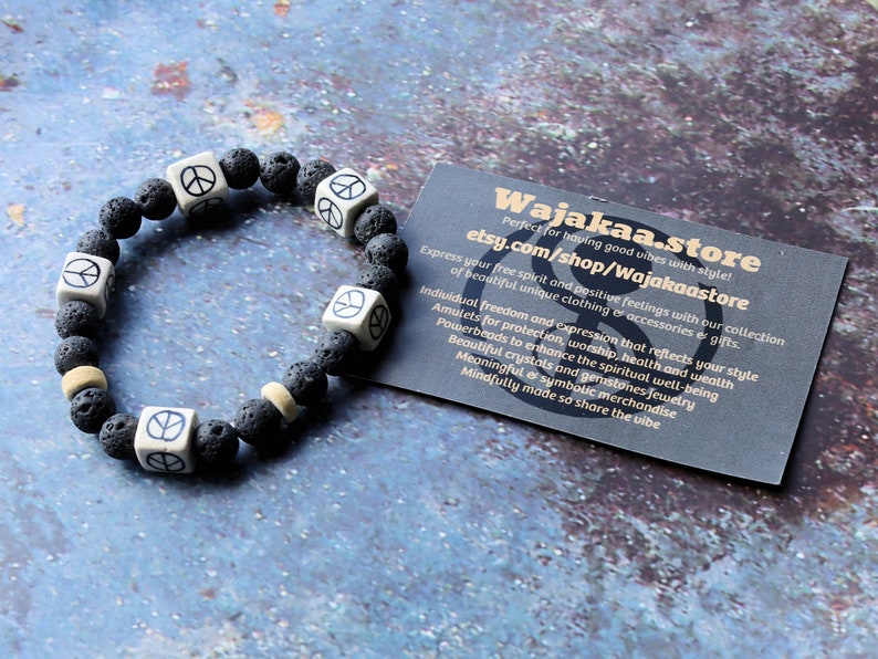 Peaceful grey Lava stones bracelet combined with Ceramic Cube Peace Sign Design.Symbol designed for the British nuclear disarmament movement