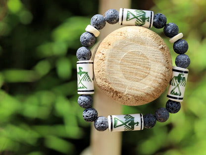 Legendary Thunderbird bead with grey Lava stones bracelet. It is considered a supernatural being of power and strength.
