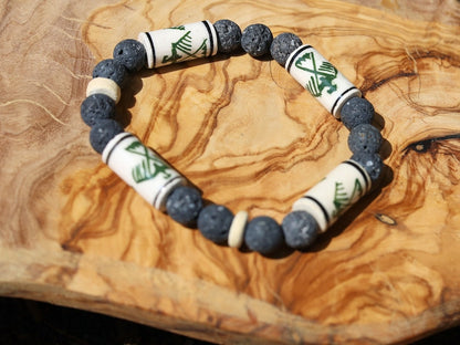 Legendary Thunderbird bead with grey Lava stones bracelet. It is considered a supernatural being of power and strength.