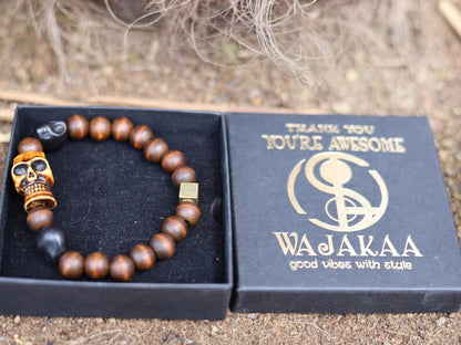 Odd wooden bracelet with Polyresin Mens Skull Bead. Unique and shows the vital Buddhist symbol of emptiness the quality of the universe.
