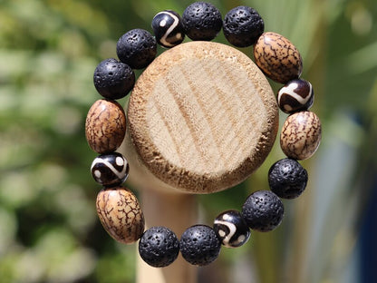 Fervid 12 mm Lava bracelet with beautiful Undyed & Natural Bodhi Beads. Combined with Om Mani Padme Hum beads. The jewel is in the lotus