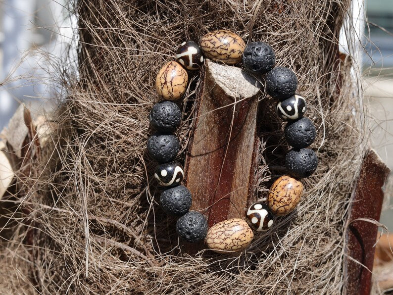 Fervid 12 mm Lava bracelet with beautiful Undyed & Natural Bodhi Beads. Combined with Om Mani Padme Hum beads. The jewel is in the lotus