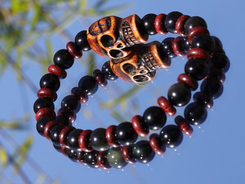 Disturbing  Obsidian Grade AA, with  wooden spacer beads. Symbolically, wood has a strong connection with the Earth and nature.
