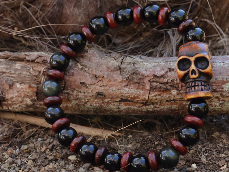 Disturbing  Obsidian Grade AA, with  wooden spacer beads. Symbolically, wood has a strong connection with the Earth and nature.