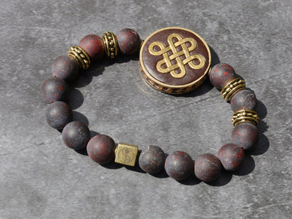 Adventurous Natural Saffron Jasper Beads , High Quality in Matte Round. Combined with Chinese Knot and a Wajakaa © Logo bead.
