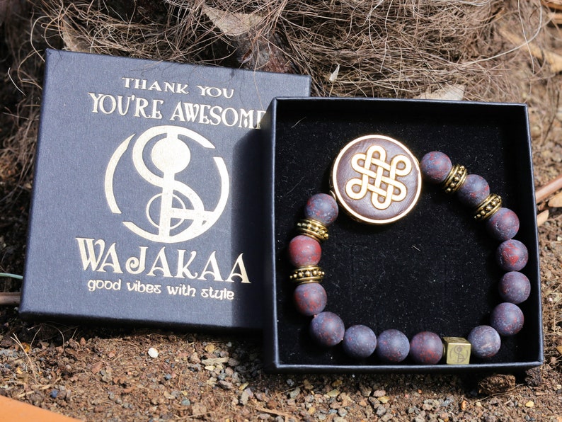 Adventurous Natural Saffron Jasper Beads , High Quality in Matte Round. Combined with Chinese Knot and a Wajakaa © Logo bead.