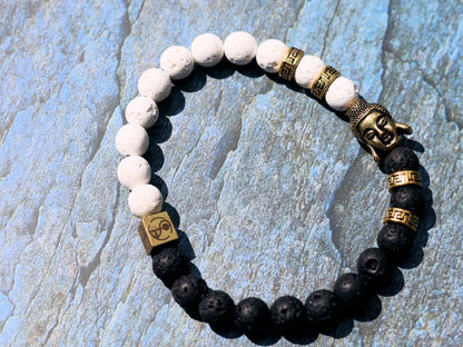 Astral black and white lava bracelet with Antique Style Buddha head and Wajakaa © Logo bead. provides strength and clear thinking