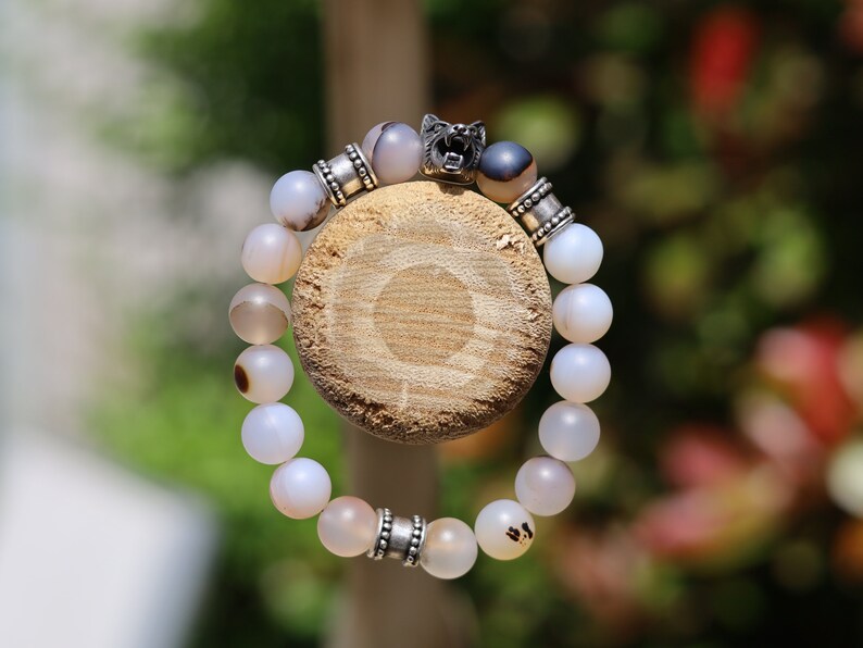 Vet Matte Moss Agate Beads bracelets combined with a Wolf Head. Unique, handmade symbolic jewelry that reflects your style & beliefs.