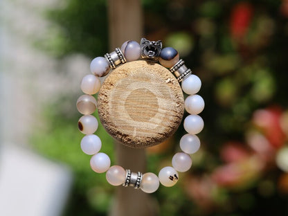 Vet Matte Moss Agate Beads bracelets combined with a Wolf Head. Unique, handmade symbolic jewelry that reflects your style & beliefs.