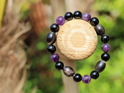 Far-out Tourmaline and Amethyst crystal bracelet with A very nice set of 4 handmade Horn Beads.  presence of compassion and wisdom