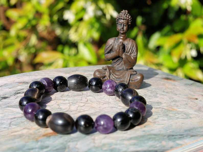 Far-out Tourmaline and Amethyst crystal bracelet with A very nice set of 4 handmade Horn Beads.  presence of compassion and wisdom