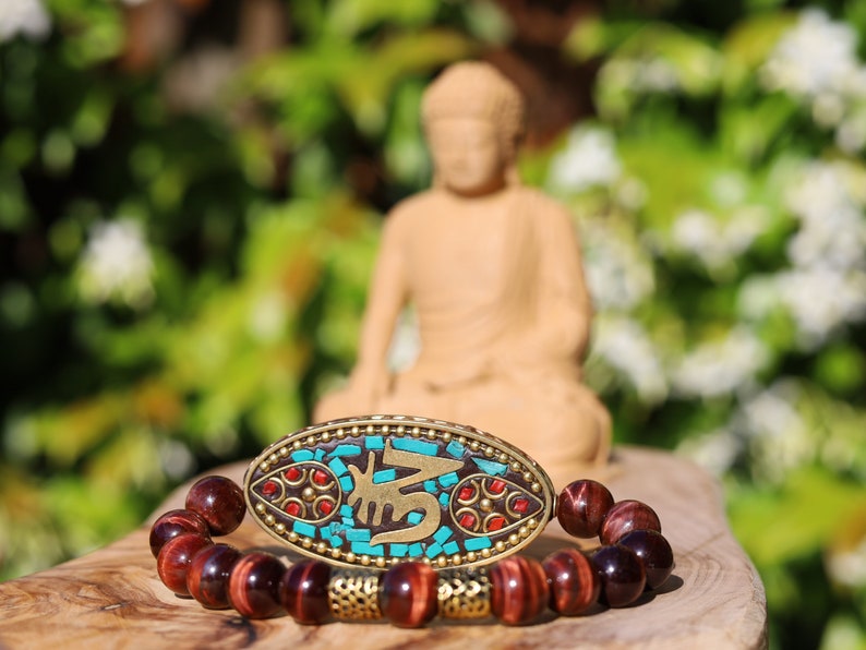 Swank Red Tiger Eye bracelet combined with a Handmade big truly inspiring Indonesia Bead. "The jewel is in the lotus".