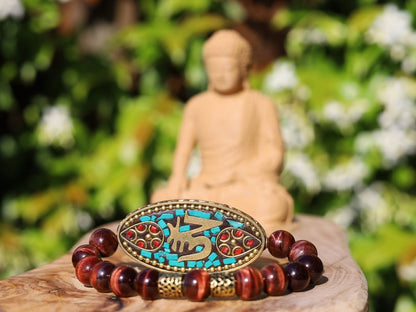 Swank Red Tiger Eye bracelet combined with a Handmade big truly inspiring Indonesia Bead. "The jewel is in the lotus".