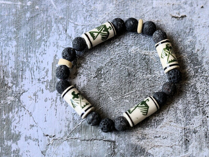 Legendary Thunderbird bead with grey Lava stones bracelet. It is considered a supernatural being of power and strength.