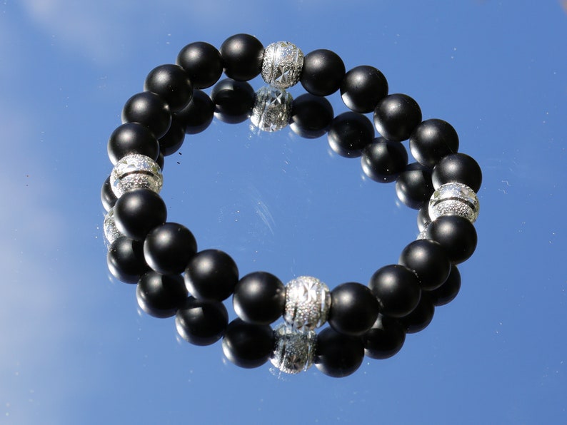 Amiable 10 mm black MATT Agate/carnelian combined with beautiful shiny Silver Color Plated rondelle. Beautiful spiritual gemstones