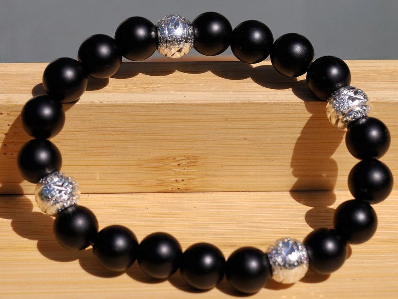 Amiable 10 mm black MATT Agate/carnelian combined with beautiful shiny Silver Color Plated rondelle. Beautiful spiritual gemstones